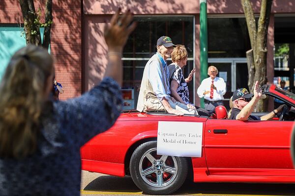 Larry Taylor rides in the parade, seated next to his wife Toni and Sergeant Dave Hill in the front seat. The Coolidge National Medal of Honor Heritage Center, city of Chattanooga, Hamilton County and Chattanooga Area Veterans Council held a “Welcome Home” parade for new Medal of Honor recipient Larry Taylor of Signal Mountain. (Photo Courtesy of Olivia Ross)