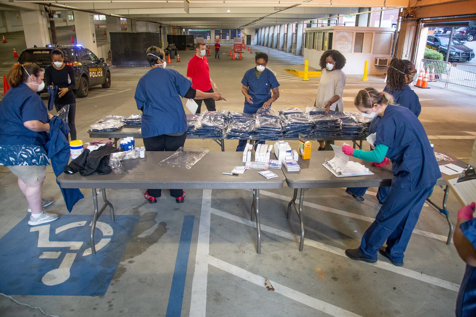 CVS employees get ready for the opening of the COVID-19 drive-thru testing center in Atlanta on April 6, 2020. STEVE SCHAEFER / Special to The AJC