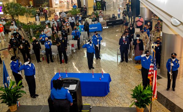 Hartsfield-Jackson Atlanta International Airport and TSA officials remember Sept 11, 2001 and hold services in the atrium of Concourse F on Saturday, Sept 11, 2021.  The event included the TSA Honor Guard who presented the colors, a moment of silence led by US Army chaplains at 8:46 am, when the first plane hit; a candle lighting for each airplane and musical selections including the National Anthem.  (Jenni Girtman for The Atlanta Journal - Constitution)