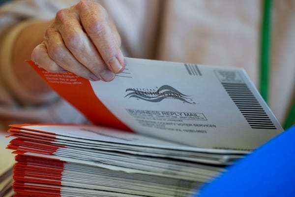 Election workers process mail-in ballots for the 2024 General Election at the Chester County, Pa., administrative offices, Tuesday, Nov. 5, 2024, in West Chester, Pa. (AP Photo/Matt Slocum)