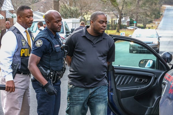 Police arrested Cameron Tucker, who they say is the owner of two dogs involved in the attack, from a home on Chicamauga Avenue not far from where the attacks occurred.  JOHN SPINK /JSPINK@AJC.COM