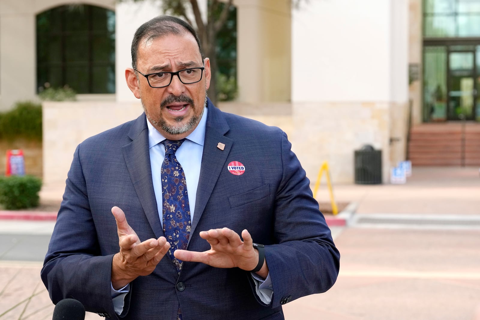 Adrian Fontes, Arizona Secretary of State, speaks during a news conference after voting on the first day of early in-person voting for the general election at Surprise City Hall Wednesday, Oct. 9, 2024, in Surprise, Ariz. (AP Photo/Ross D. Franklin)