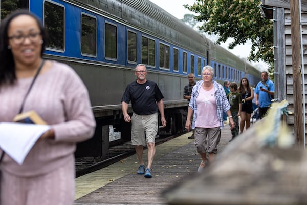 Tourists get off the SAM Shortline excursion train in downtown Plains on Saturday, February 25, 2023. (Arvin Temkar / arvin.temkar@ajc.com)