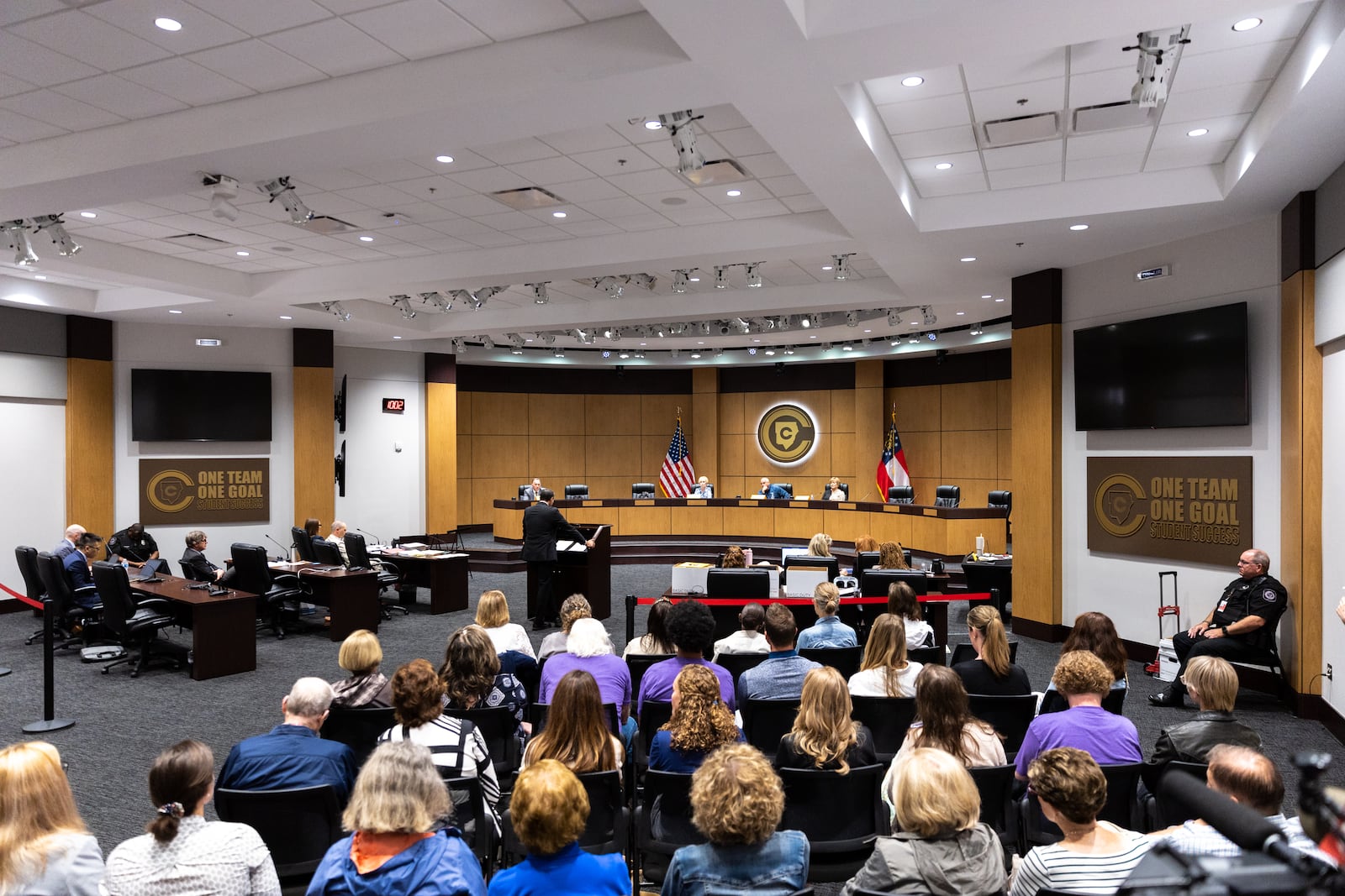 Several dozen people attend a hearing for teacher Katie Rinderle at the Cobb County Board of Education in Marietta on Thursday, August 10, 2023. Rinderle is facing termination after reading “My Shadow is Purple,” a book about gender identity, to fifth graders. (Arvin Temkar / arvin.temkar@ajc.com)