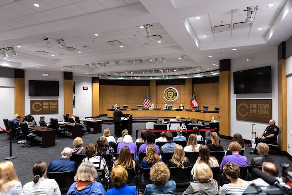 Several dozen people attend a hearing for teacher Katie Rinderle at the Cobb County Board of Education in Marietta on Thursday, August 10, 2023. Rinderle is facing termination after reading “My Shadow is Purple,” a book about gender identity, to fifth graders. (Arvin Temkar / arvin.temkar@ajc.com)