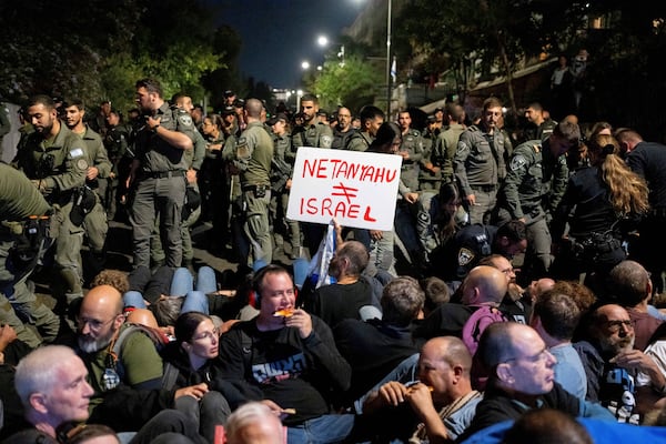 Police disperse people protesting against Prime Minister Benjamin Netanyahu's government and calling for the release of hostages held in the Gaza Strip by the Hamas militant group, near the Prime Minister's residence in Jerusalem, Monday, Oct. 28, 2024. (AP Photo/Ohad Zwigenberg)