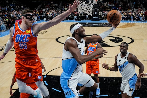 Atlanta Hawks guard Caris LeVert (3) shoots against against the Oklahoma City Thunder during the first half of an NBA basketball game, Friday, Feb. 28, 2025, in Atlanta. (AP Photo/Mike Stewart)