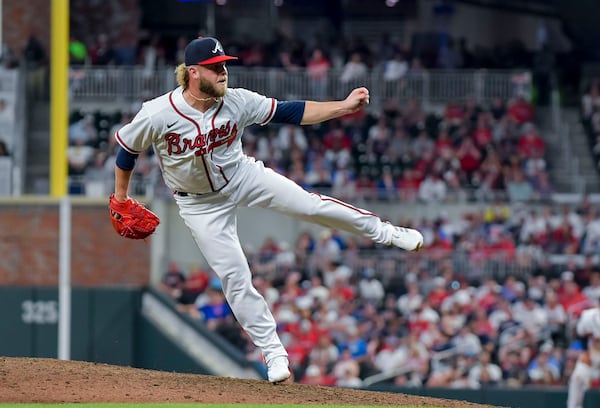 Atlanta Braves relief pitcher A.J. Minter (33) delivers against the San Diego Padres Thursday, April 6, 2023 at Truist Park in Atlanta. (Daniel Varnado / For the AJC)