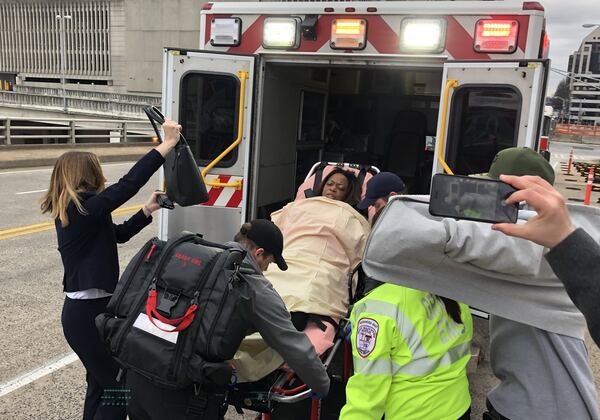 Katrina Taylor-Parks, the deputy chief of staff to former Atlanta Mayor Kasim Reed, is led out of the Richard B. Russell Federal Building by paramedics after she collapsed during her sentencing in the federal probe of corruption at Atlanta City Hall. BILL TORPY/BTORPY@AJC.COM