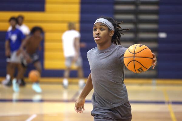 Eagle’s Landing High School sophomore Christian Spencer practices on the JV basketball team, Wednesday, December 21, 2022, in McDonough, Ga.. Spencer, who has autism, overcame the odds to earn a spot on the Eagle’s Landing JV basketball team. (Jason Getz / Jason.Getz@ajc.com)