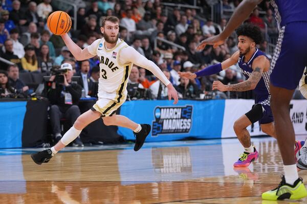 Purdue guard Braden Smith (3) looks to pass against High Point during the first half in the first round of the NCAA college basketball tournament, Thursday, March 20, 2025, in Providence, R.I. (AP Photo/Charles Krupa)