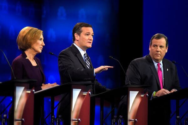 Ted Cruz, center, speaks as Carly Fiorina, left, and Chris Christie listen during the CNBC Republican presidential debate at the University of Colorado, Wednesday, Oct. 28, 2015, in Boulder, Colo. (AP Photo/Mark J. Terrill)