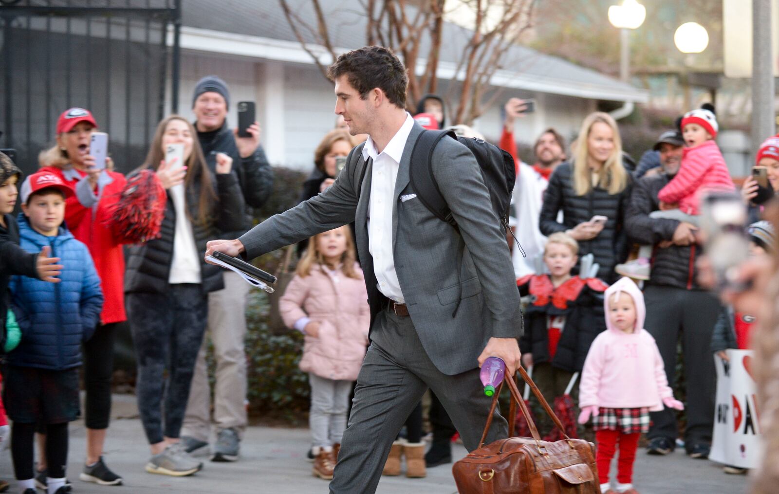 Senior quarterback Stetson Bennett greets fans Friday, Jan. 7, 2022 at Butts-Mehre Heritage Hall on UGA’s campus in Athens. (Daniel Varnado/For the Atlanta Journal-Constitution)