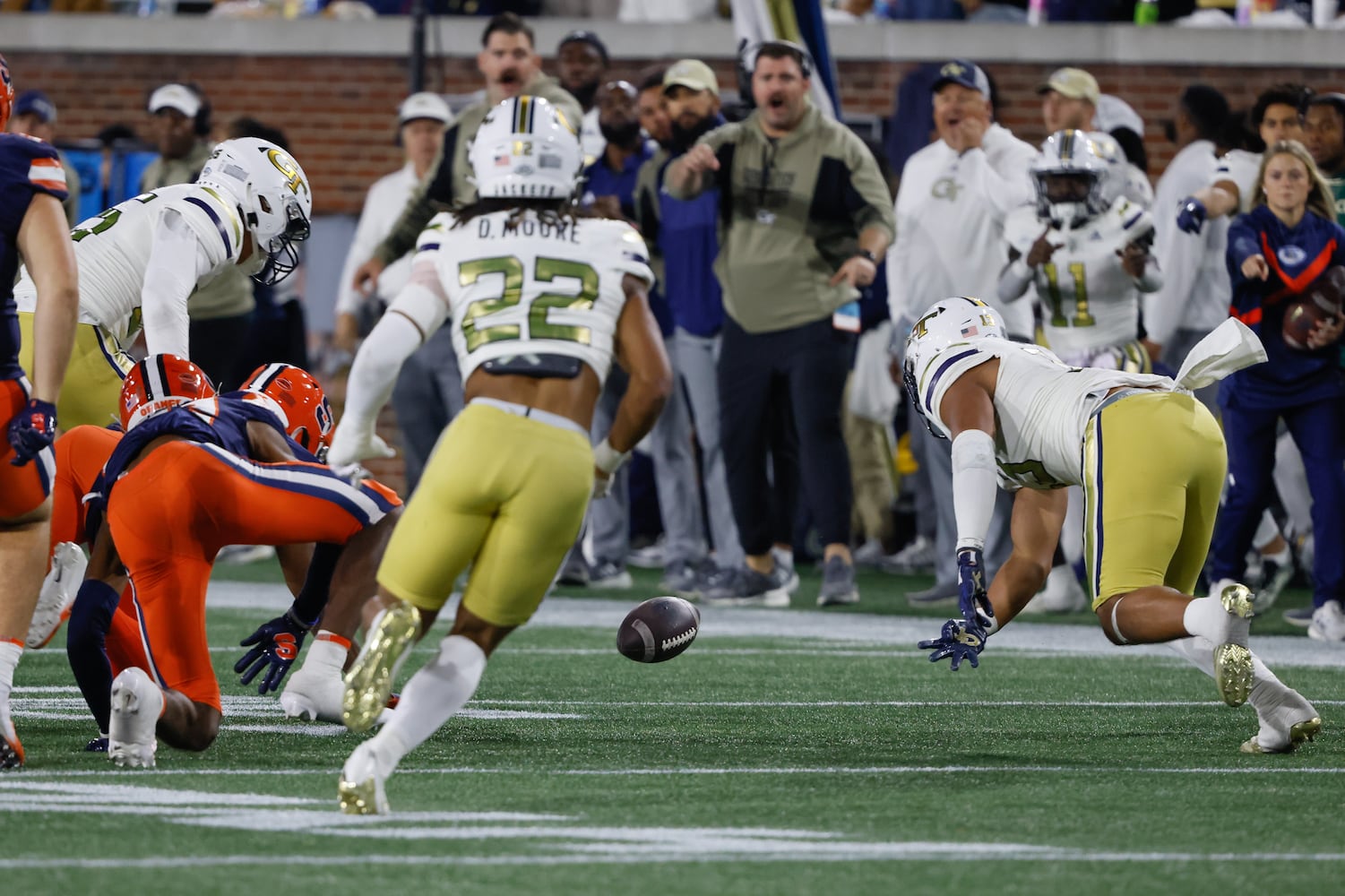 On the second half kickoff, Syracuse Orange wide receiver Darrell Gill Jr. (82) fumbled, forced by Georgia Tech Yellow Jackets linebacker Paul Moala (13) and recovered by Georgia Tech Yellow Jackets linebacker Jacob Cruz (35) during an NCAA college football game between Georgia Tech and Syracuse in Atlanta on Saturday, Nov. 18, 2023.  Georgia Tech won, 31 - 22. (Bob Andres for the Atlanta Journal Constitution)