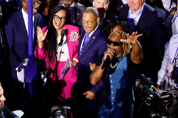 Rapper Lil Jon, right, performs with the Georgia delegation during the ceremonial Roll Call of States on the second day of the Democratic National Convention at the United Center on Tuesday in Chicago. (Chip Somodevilla/Getty Images/TNS)