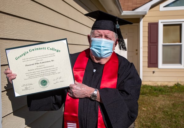 Portrait of 82-year-old Prescott Lawrence in his graduation cap & gown at his home in Grayson, Ga. He recently graduated from Georgia Gwinnett College with a degree he never plans to use. He believes the key to life is feeding the mind and caring for the body. PHIL SKINNER FOR THE ATLANTA JOURNAL-CONSTITUTION.