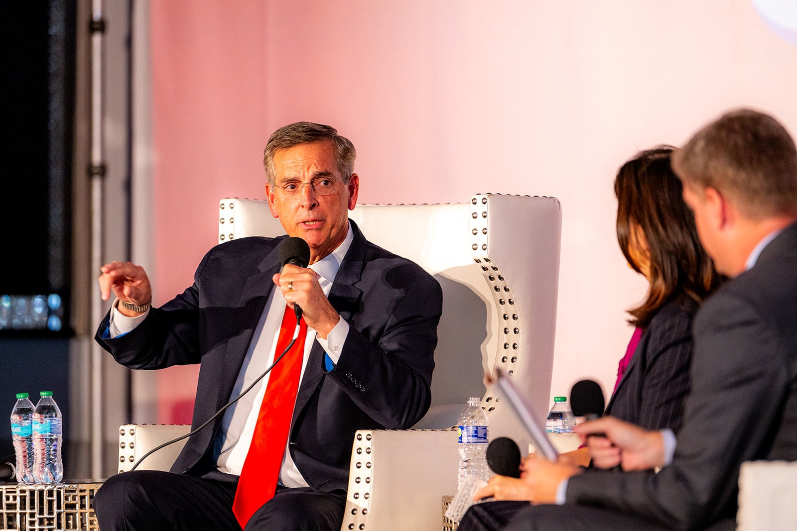 Secretary of State Brad Raffensperger (left) speaks during the AJC's Politically Georgia subscriber event on Tuesday, Oct. 22, 2024. (Lauren Hubbard for the AJC)