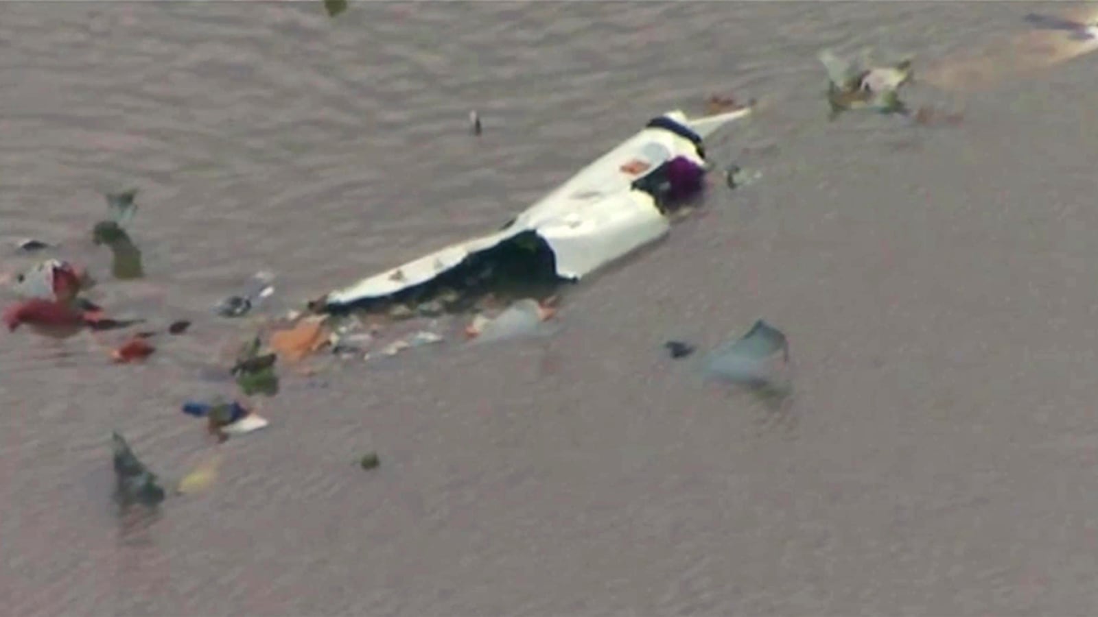 This image taken from video provided by KRIV FOX 26 shows the scene of a cargo plane crash on Saturday, Feb. 23, 2019 in Trinity Bay, just north of Galveston Bay and the Gulf of Mexico in Texas.  Lynn Lunsford with the Federal Aviation Administration did not immediately know the status of the people aboard and the Chambers County Sheriff's Office could not immediately be reached for comment.  (KRIV FOX 26 via AP)