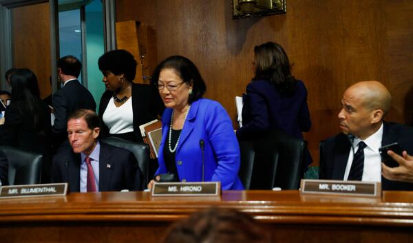 Democratic Senators stand to walk out of a Senate Judiciary Committee meeting, Friday, Sept. 28, 2018 on Capitol Hill in Washington (AP Photo/Pablo Martinez Monsivais)