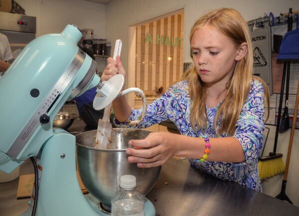 Alden Wright, 9, concentrates on making her Edible Sugar Cookie Dough just right. CONTRIBUTED BY CHRIS HUNT PHOTOGRAPHY