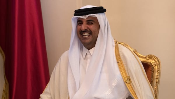 Sheikh Tamim bin Hamad Al Thani, the Emir of Qatar, smiles as he talks with British Prime Minister Theresa May during a bilateral meeting at the Gulf Cooperation Council summit, on December 7, 2016 in Manama, Bahrain.