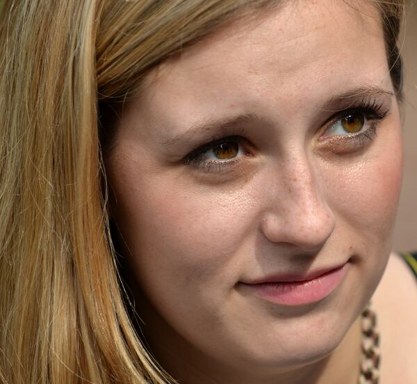 Agnes Scott College student Grace Starling carried a mattress around campus to show support for sexual assault victims as part of a national day of action, Carry That Weight Wednesday October 29, 2014. BRANT SANDERLIN / BSANDERLIN@AJC.COM