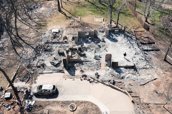 An aerial view of Andrine Shufran's burned home in the Hidden Oaks neighborhood in Stillwater, Okla., Monday, March 17, 2025, after wildfires burned through the area Friday. (AP Photo/Alonzo Adams)