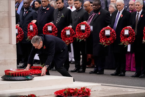 Britain's Prime Minister Keir Starmer lays a wreath during the Remembrance Sunday Service at the Cenotaph in London, Sunday, Nov. 10, 2024. (AP Photo/Alberto Pezzali)