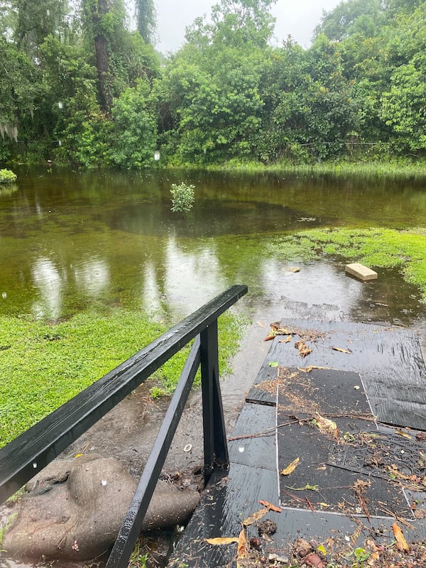 The flooded backyard of retirees Willie Adam and his wife Theresa in Brunswick, Georgia's College Park neighborhood on Tuesday, Aug. 6, 2024.