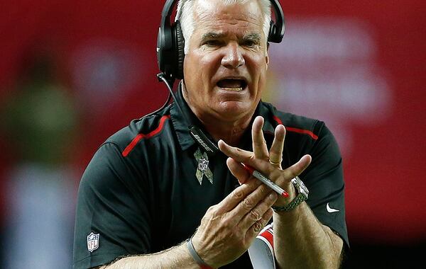 Atlanta Falcons head coach Mike Smith tries to call a time out during the first half of an NFL football game against the Cleveland Browns, Sunday, Nov. 23, 2014, in Atlanta. (AP Photo/John Bazemore) Atlanta Falcons head coach Mike Smith tries to call a time out during the first half of an NFL football game against the Cleveland Browns, Sunday, Nov. 23, 2014, in Atlanta. (AP Photo/John Bazemore)