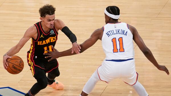 New York Knicks' Frank Ntilikina (right) guards Atlanta Hawks' Trae Young during the second half of Game 1 of first-round playoff series, Sunday, May 23, 2021, in New York. The Hawks won 107-105. (Seth Wenig/AP)