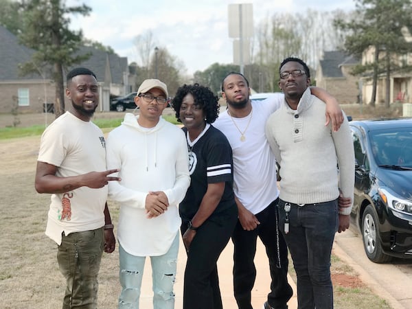 Kim McNair (center) poses with her sons, (left to right): Jeffrey McNair, Sadaris McNair, DelShawn Wilson and Ronald Modeste III. McNair plans to hire a financial adviser to invest her money.