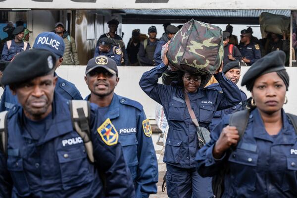 Former members of the Armed Forces of the Democratic Republic of Congo (FARDC) and police officers who allegedly surrendered to M23 rebels arrive in Goma, Congo, Sunday, Feb. 23, 2025. (AP Photo/Moses Sawasawa)