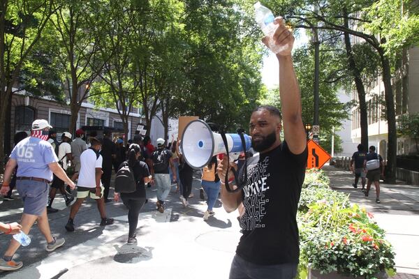 Leaders of OneRace’s “March on Atlanta” lead marchers to the state Capitol Friday, June 19, 2020. The Juneteenth observance included prayer and worship at Centennial Olympic Park before marching to the Capitol for a rally. 