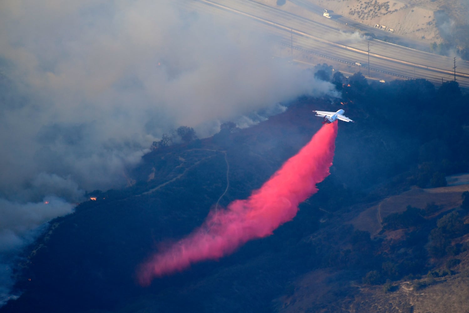 Photos: Deadly wildfires blaze through northern, southern California