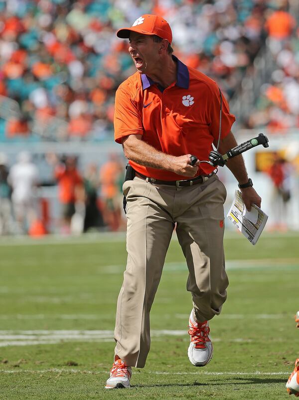 MIAMI GARDENS, FL - OCTOBER 24: Head coach Dabo Swinney of the Clemson Tigers reacts to a play during a game against the Miami Hurricanes at Sun Life Stadium on October 24, 2015 in Miami Gardens, Florida. (Photo by Mike Ehrmann/Getty Images)