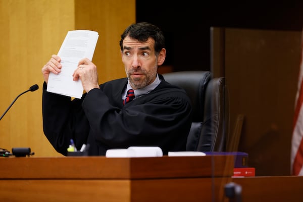 Fulton County Superior Court Judge Robert McBurney reacts to arguments by D.A. Fani Willis during a Jan. 24, 2023 hearing over whether to release the final report of a special grand jury. Miguel Martinez / miguel.martinezjimenez@ajc.com