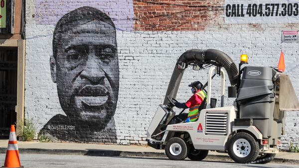 April 19, 2021 Atlanta: The Ambassador Force cleaned along Simpson Street at Marietta Street in downtown Atlanta on Monday, April 19, 2021 where a large mural of George Floyd is painted. (John Spink / John.Spink@ajc.com)

