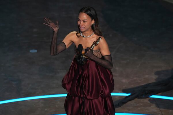 Zoe Saldana accepts the award for best performance by an actress in a supporting role for "Emilia Perez" during the Oscars on Sunday, March 2, 2025, at the Dolby Theatre in Los Angeles. (AP Photo/Chris Pizzello)