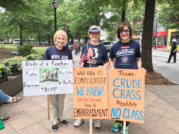 Protesters gathered in Woodruff Park Friday morning to protest President Donald Trump's speech to the National Rifle Association convention in downtown Atlanta.