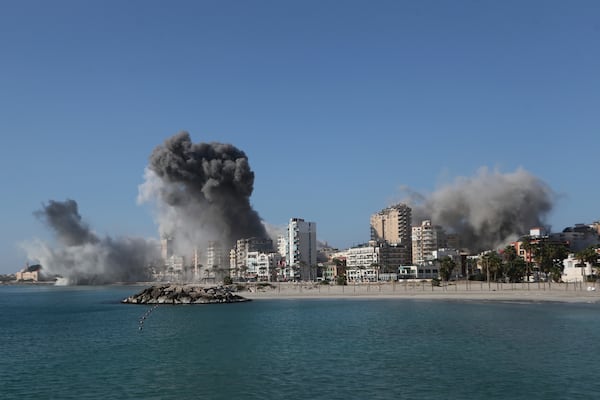 Smoke rise from buildings hit in Israeli airstrikes in Tyre, southern Lebanon, Monday, Oct. 28, 2024. (AP Photo/Mohammad Zaatari)