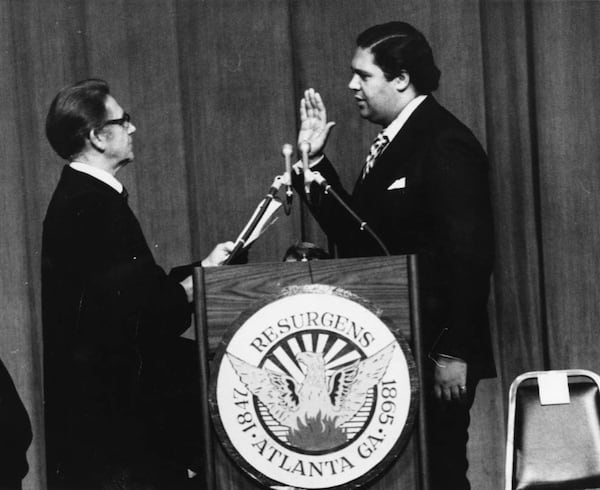 Maynard Jackson, shown taking the oath of office as mayor on Jan. 7, 1974, helped more black-owned businesses succeed in Atlanta by requiring the city to set aside a percentage of contracts for minority-owned businesses. (Charles Pugh/AJC 1974 photo)