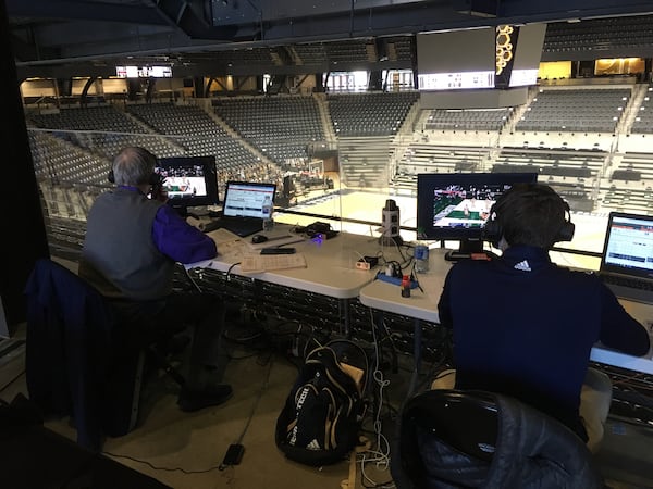 Georgia Tech voice Andy Demetra (right) and analyst Randy Waters (left) call the Yellow Jackets basketball game against Miami inside an empty McCamish Pavilion on Feb. 20, 2021 as it was being played in Coral Gables, Fla. Demetra and Waters have called all but two away games from Tech's campus as travel has been made more difficult by the ACC's COVID-19 protocol.