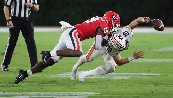 Georgia linebacker Adam Anderson levels Auburn quarterback Bo Nix on a key defensive play in the fourth quarter, Oct. 3, 2020, in Athens. (Curtis Compton/Curtis.Compton@ajc.com)