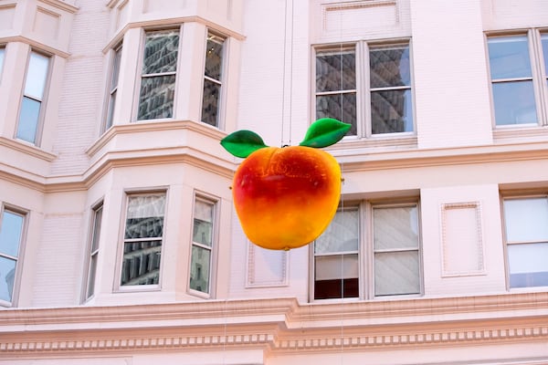 Atlantans mark New Year's Eve every year with a giant peach drop.(Alyssa Pointer / The Atlanta Journal-Constitution)