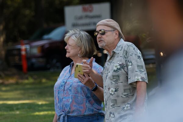 Patty and Rusty Bickford from Columbia, South Carolina, stand outside the Fulton County Jail, where they stopped by to see things unfold with the Trump indictments. (Miguel Martinez /miguel.martinezjimenez@ajc.com)