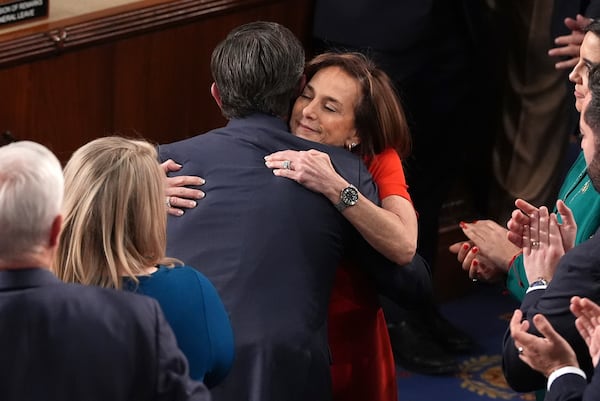 Rep. Lisa McClain, R-Mich., right, congratulates House Speaker Mike Johnson, R-La., upon Johnson's re-election as the House of Representatives meets to elect a speaker and convene the new 119th Congress at the Capitol in Washington, Friday, Jan. 3, 2025. (AP Photo/Jacquelyn Martin)