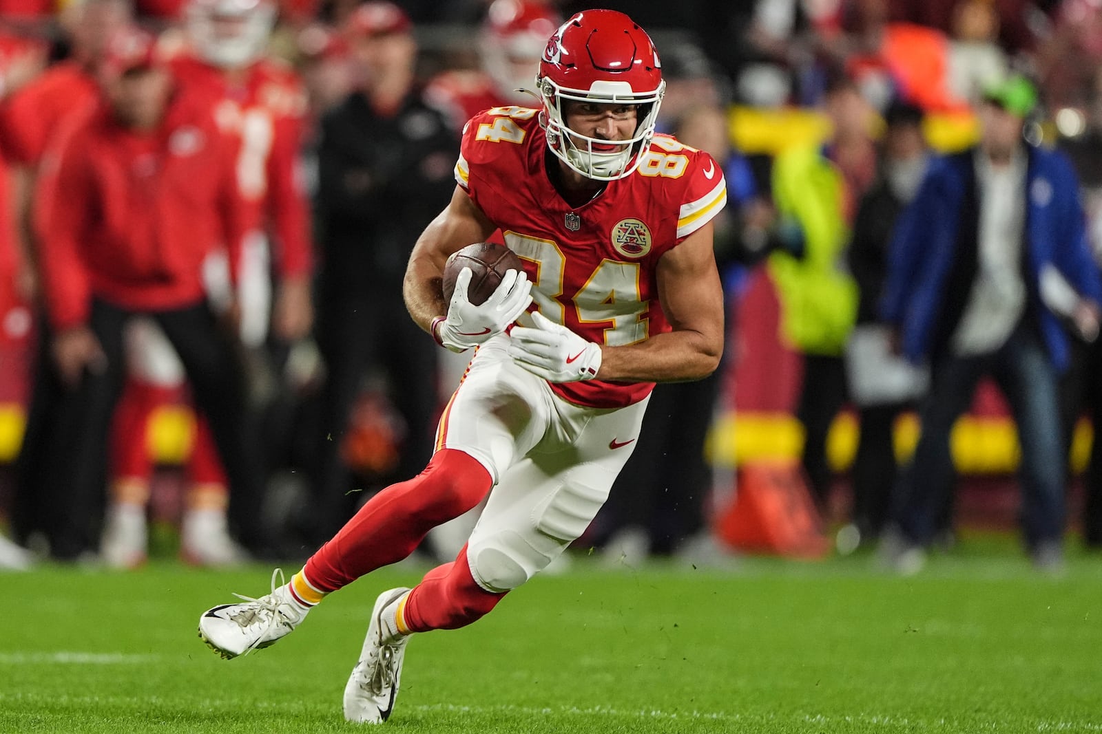 Kansas City Chiefs wide receiver Justin Watson (84) runs after a catch Tampa Bay Buccaneers during the first half of an NFL football game, Monday, Nov. 4, 2024, in Kansas City, Mo. (AP Photo/Charlie Riedel)