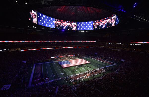 January 8, 2018 Atlanta - President Donald Trump attends during College Football Playoff National Championship at Mercedes-Benz Stadium on Monday, January 8, 2018. HYOSUB SHIN / HSHIN@AJC.COM