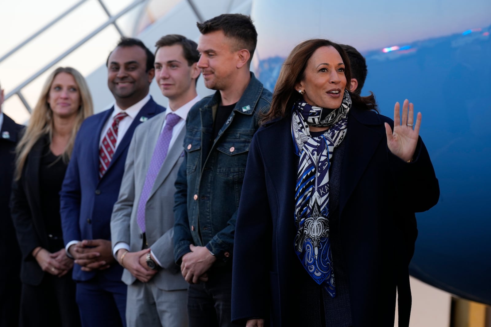 Democratic presidential nominee Vice President Kamala Harris waves at Trenton-Mercer Airport, in Mercer County, N.J., before departing en route to Milwaukee, Wednesday, Oct. 16, 2024. (AP Photo/Jacquelyn Martin)